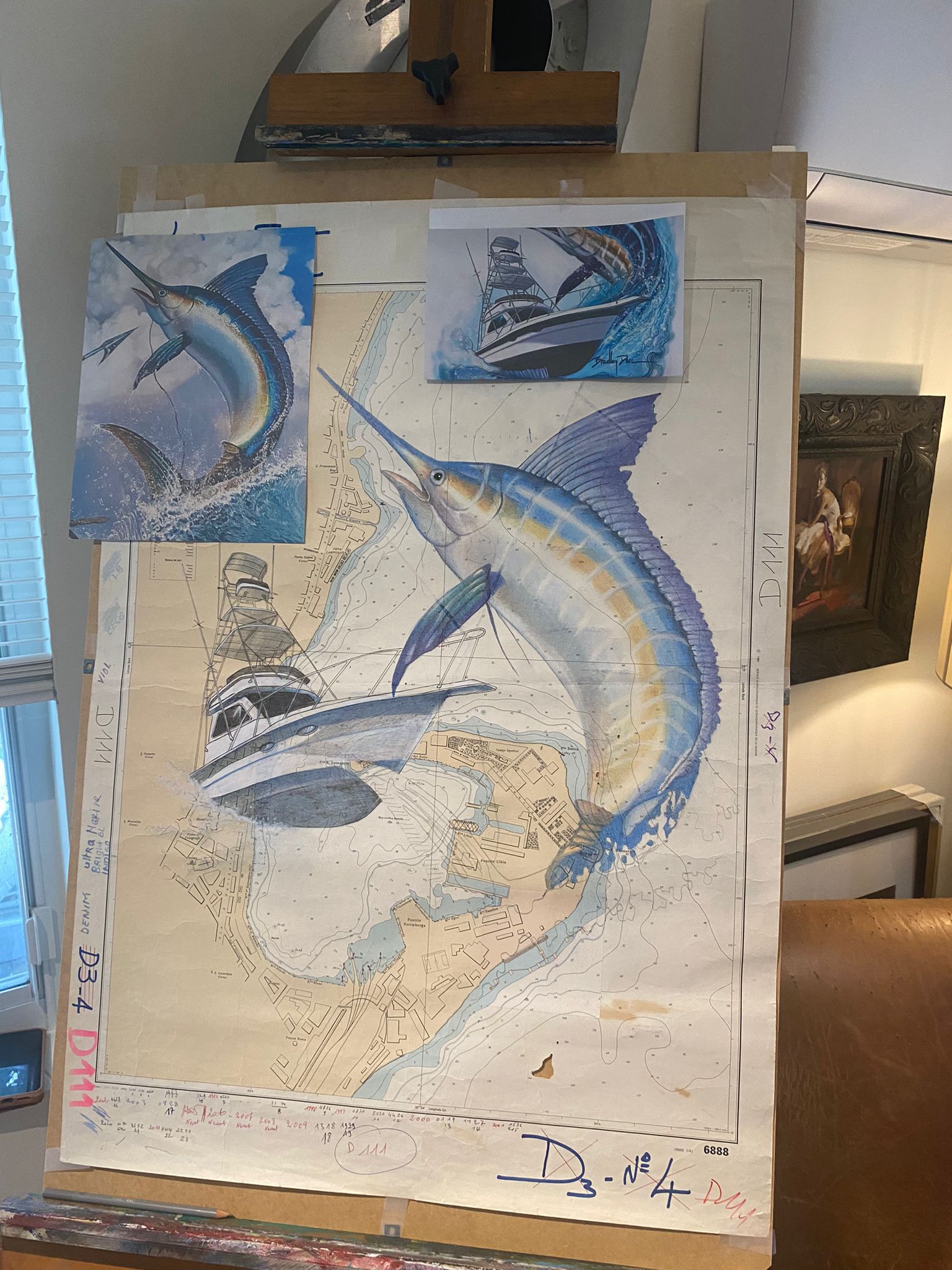 Nautical chart on easel during marlin painting process