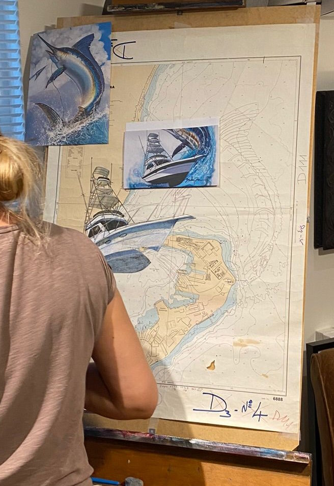 Detail view of Essebes painting marlin on nautical chart