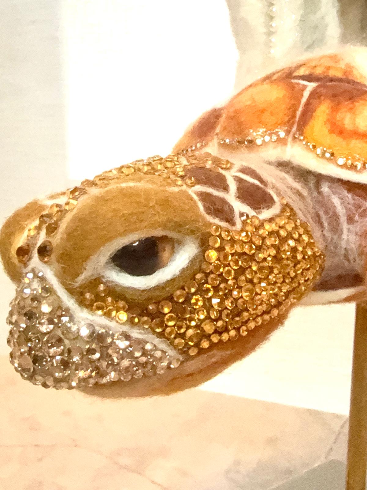 Detail of the sea turtle’s needle-felted head and gems